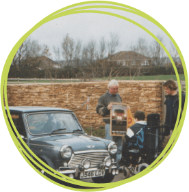 Terry Baker introduces Christopher to his Mini at the Little Bridge House children's hospice in North Devon in 1996
